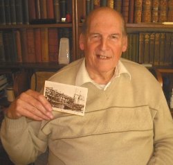 Hugh Robinson holds the poscard written by his father after he witnessed the launch of the Titanic in Belfast.